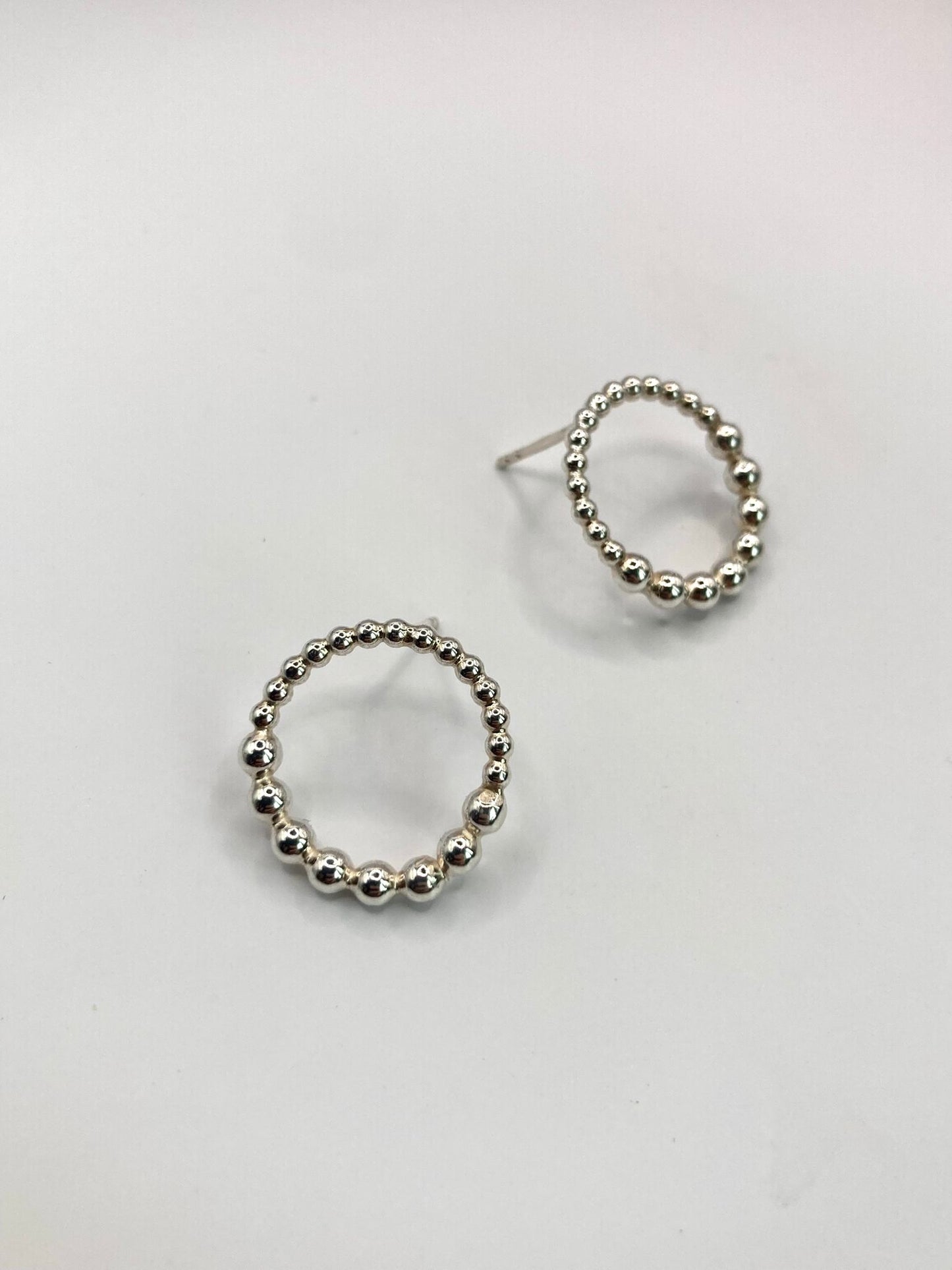 Dotty silver earrings from side