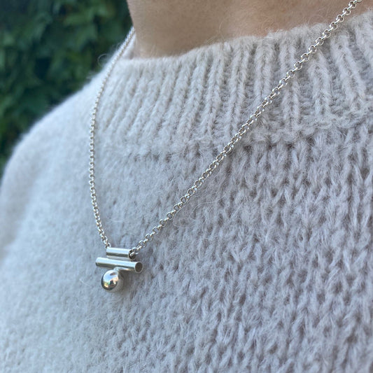 Silver necklace with ball.